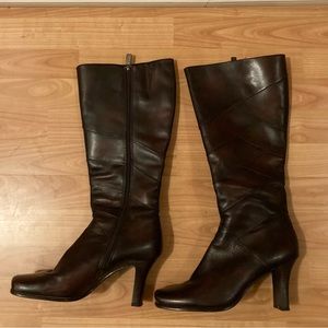 Tall, high heeled, square toed boots in size 9.